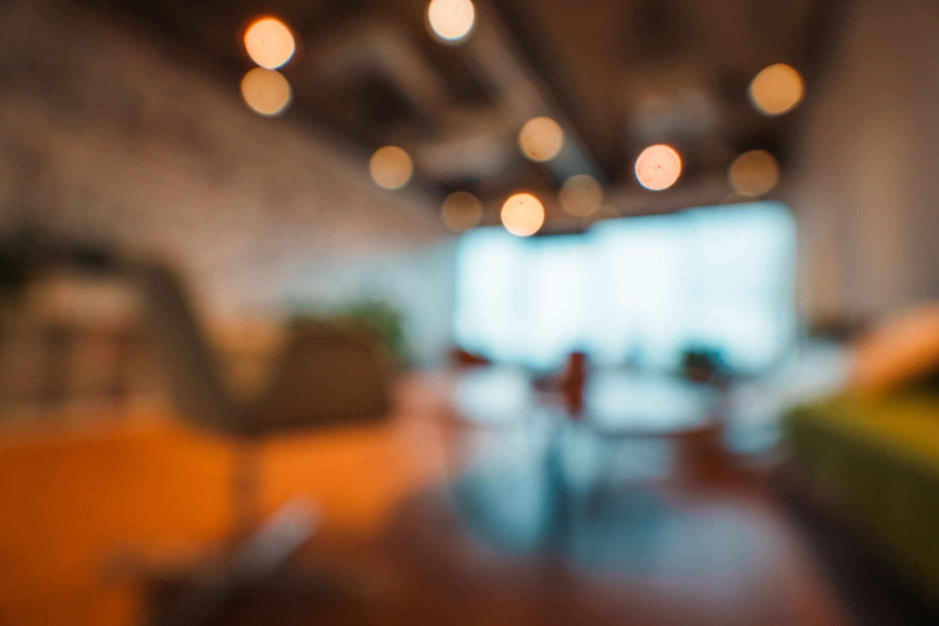 Warm, elegantly lit modern office interior with soft bokeh light